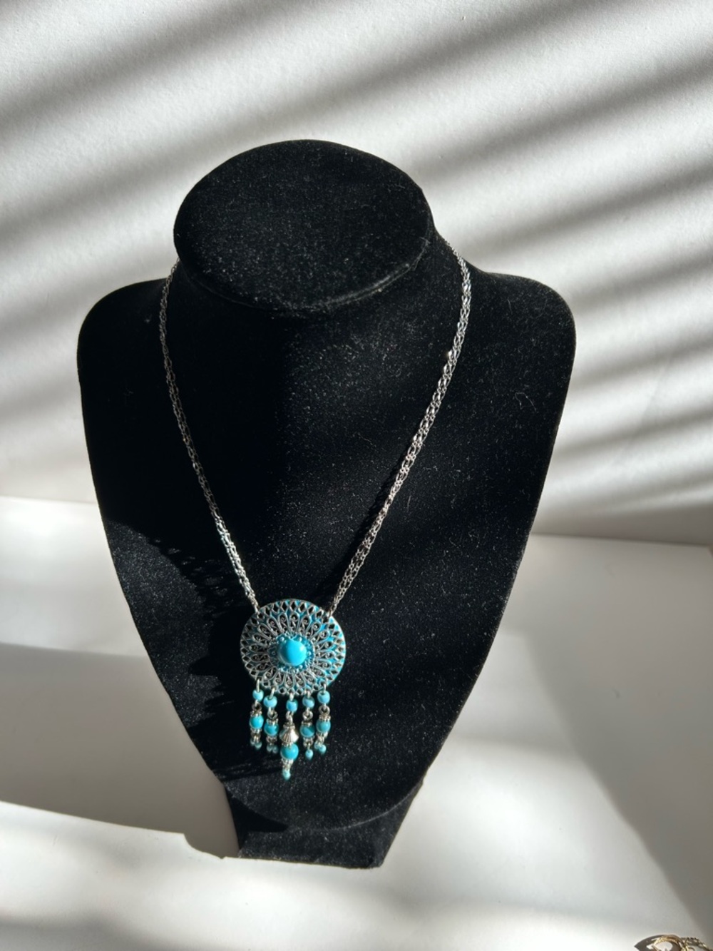vintage Avon "Southwest Style" silver-tone pendant necklace featuring blue bead